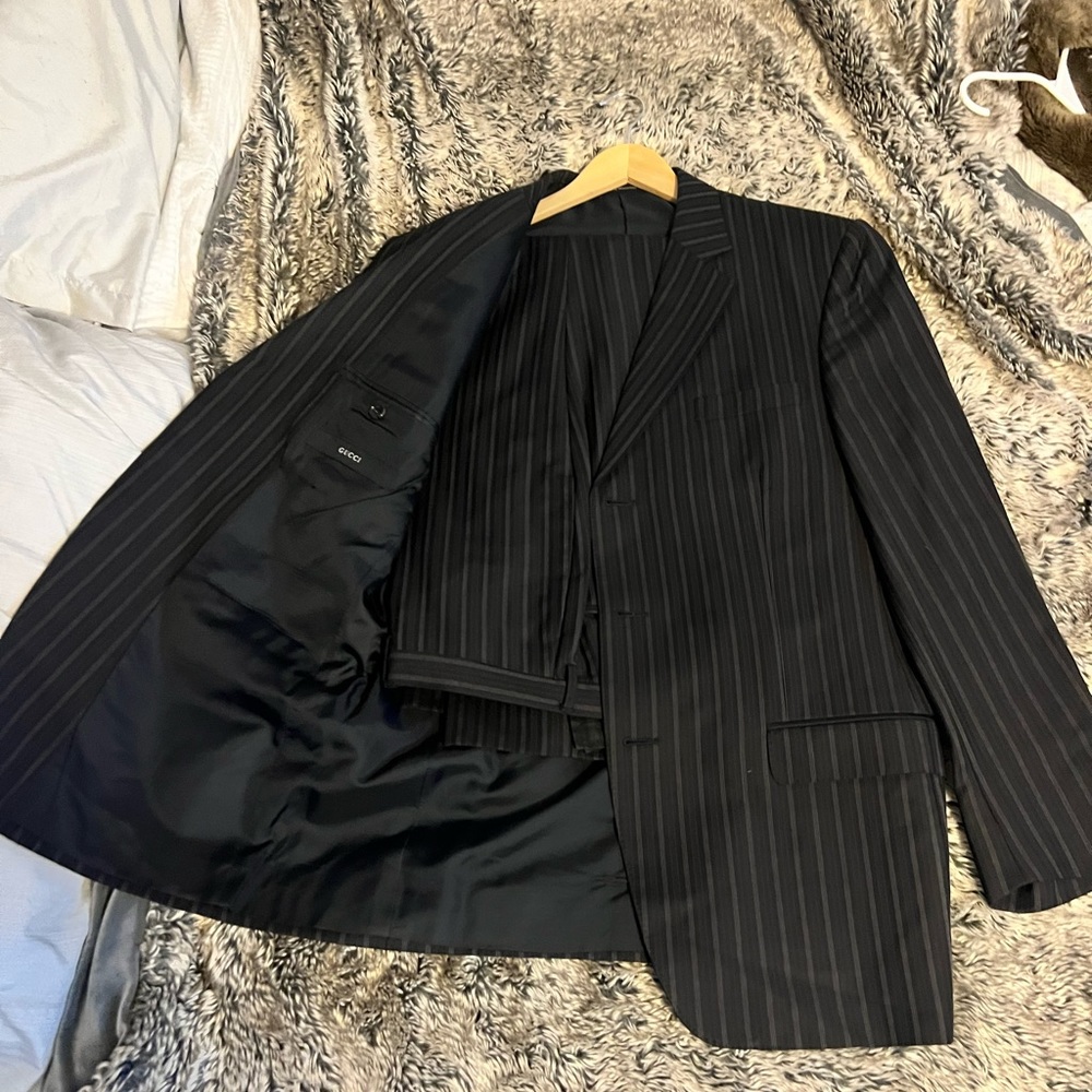 Navy blue striped Gucci suit